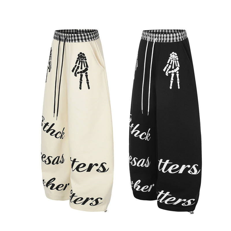 Pantalon de survêtement à jambes larges, imprimé main squelette et taille vichy