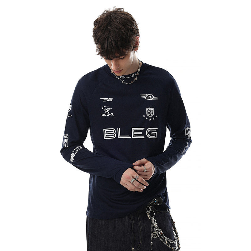 Navy long sleeve crew neck shirt worn by model with white multi-logo racing graphics