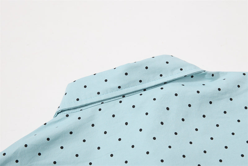 Close-up of the light blue shirt back collar and upper back with black polka dots
