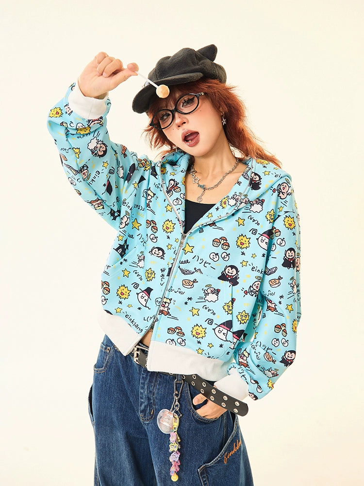 A person poses playfully, wearing a Seakoff Kawaii Cartoon Bear Hoodie featuring ears and fun cartoon prints. They pair it with a black tank top, wide-leg jeans, and a black hat with ears. Accessories include glasses, necklaces, and a charm-belt—ideal for kawaii fashion lovers.