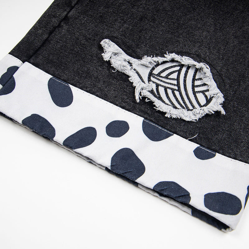 Jean noir large avec patchs chat cartoon et finitions contrastantes imprimées dalmatien