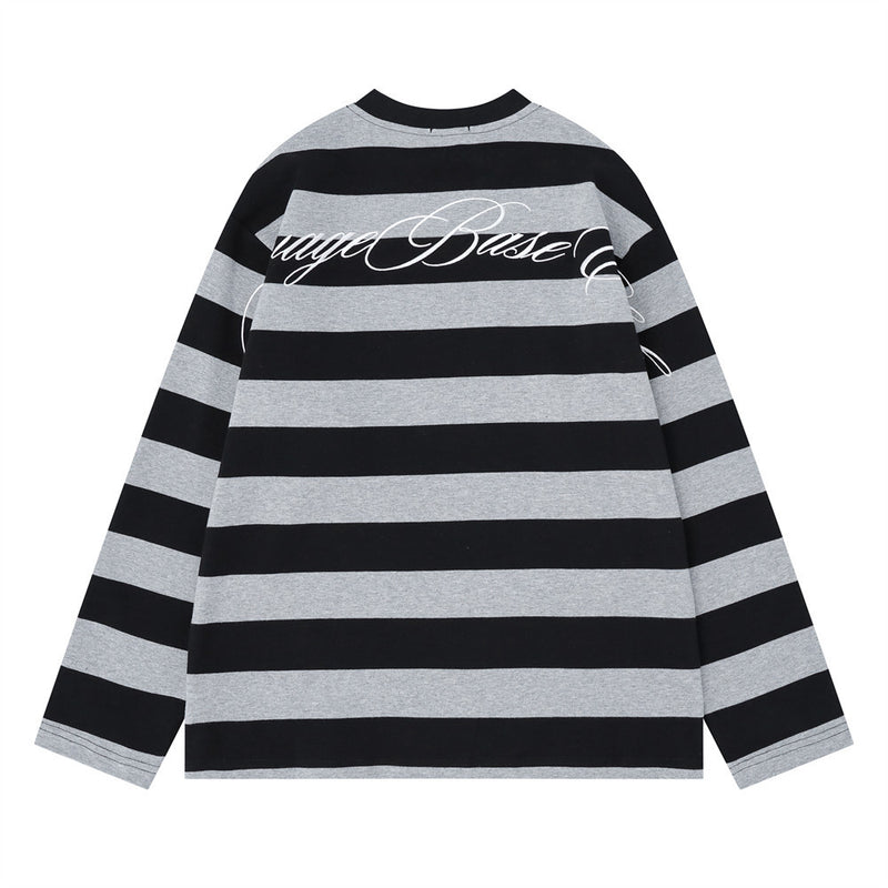 Back view of black and gray striped long sleeve shirt with large cursive graphic across the shoulders