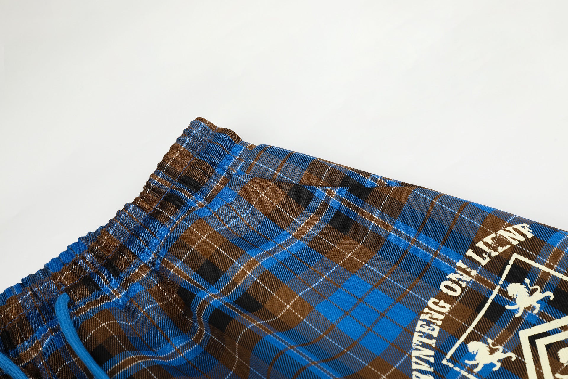 Wide-Leg Plaid Pants – Blue Tartan Baggy Fit with Crest Graphic & Drawstring Hem
