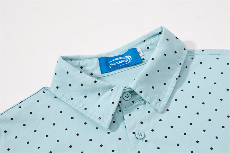Close-up of the light blue shirt collar, buttons, and neck label