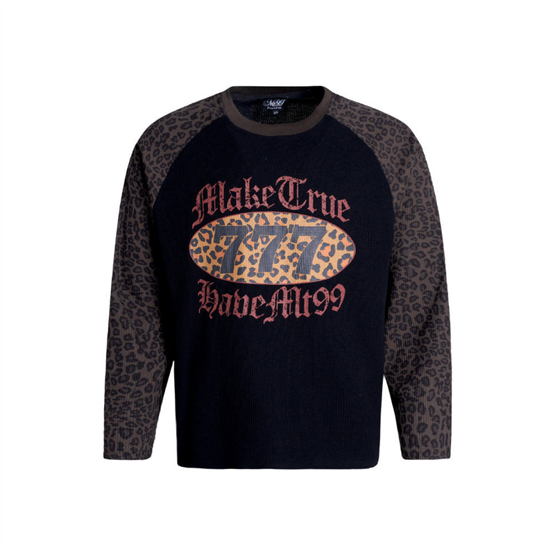 Men's black waffle-knit raglan long sleeve shirt with leopard print sleeves and gothic 777 chest graphic