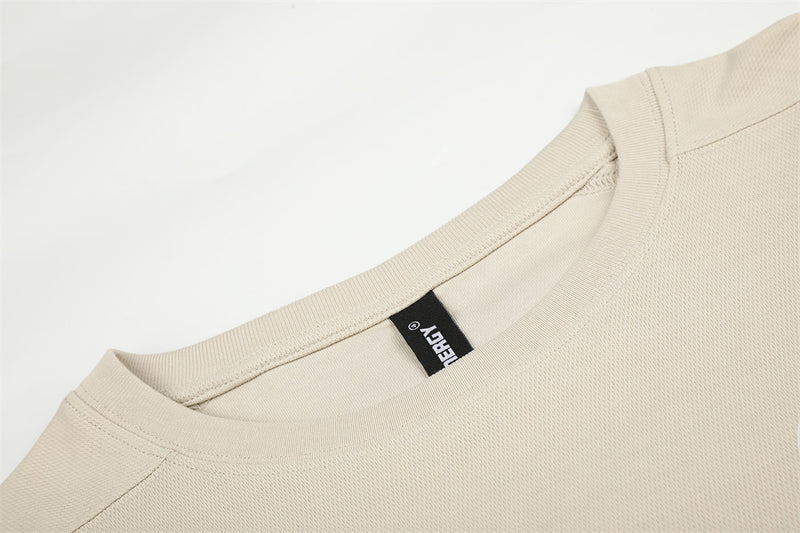 Beige crew neck collar detail with textured knit fabric