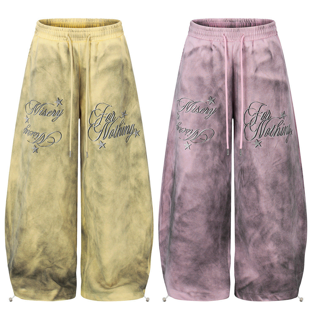 Tie-dye wide leg sweatpants with Misery For Nothing cursive embroidery and metallic star details in acid yellow and dusty pin