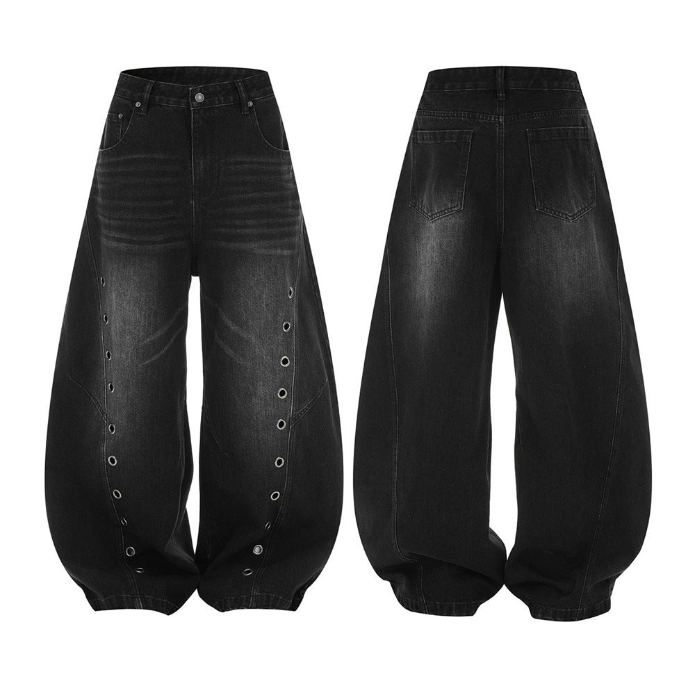 Men's washed black wide-leg punk jeans with vertical metal eyelet detail and deconstructed panel seams, front and back view