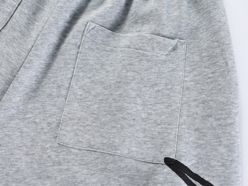 Pantalon de survêtement à jambes larges avec imprimé graffiti cursif et ceinture élastiquée siglée