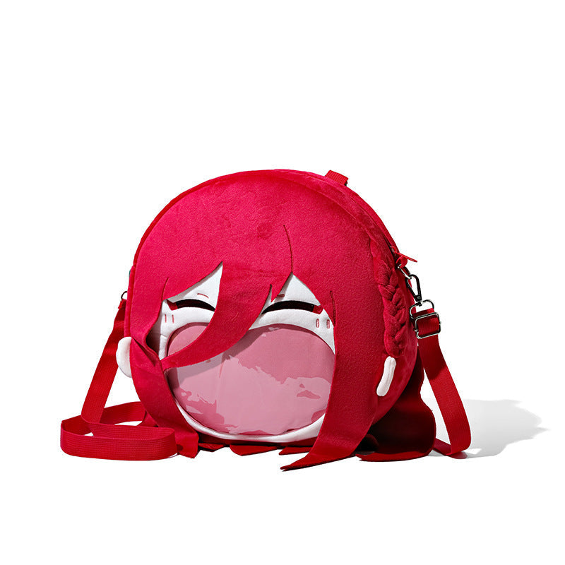 The Seakoff Blue Lock Chigiri Hyoma Plush Shoulder Bag is a round red bag shaped like a cartoon character's head with long red hair and a transparent front. It features a top zipper, adjustable strap, and is inspired by the anime design of Chigiri Hyoma from Blue Lock.