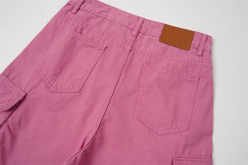 Back waistband view of rose pink cargo shorts with patch pockets and label