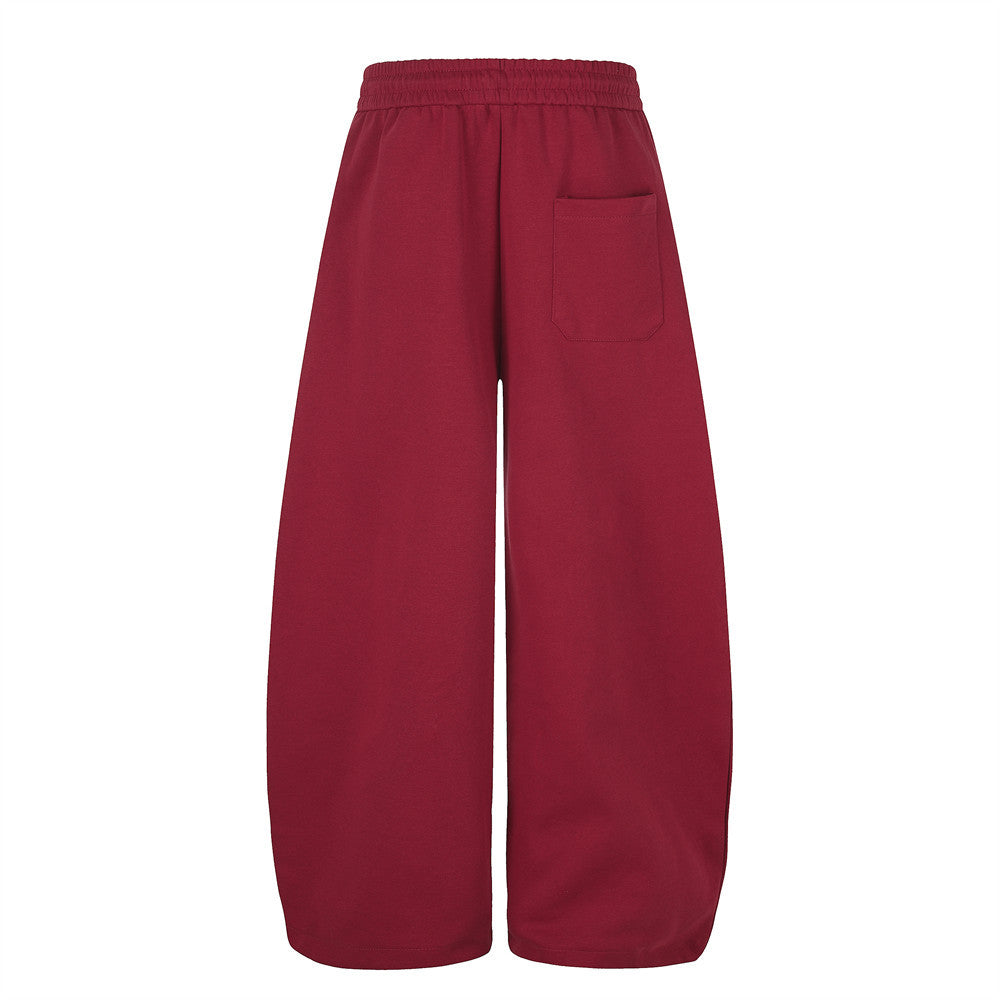 Pantalon de jogging large – Motif patte et coutures courbes rouges
