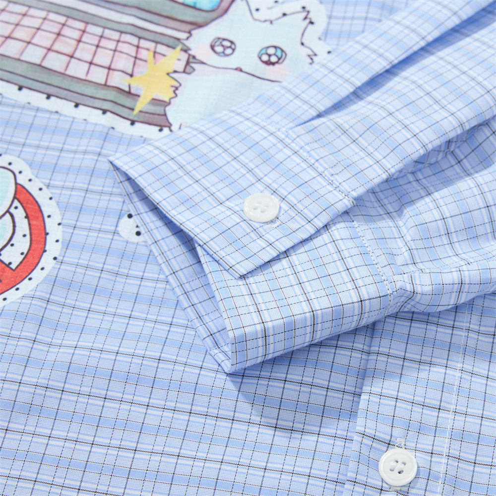 Blue plaid shirt sleeve cuff close-up with button detail