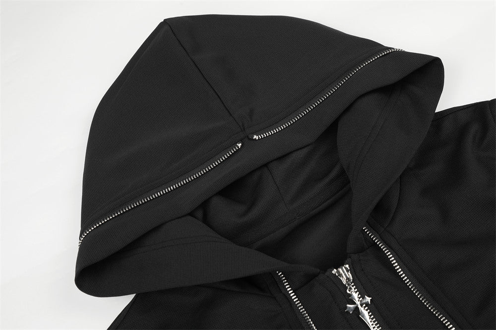 Close-up of black hood with silver zipper trim and textured fabric