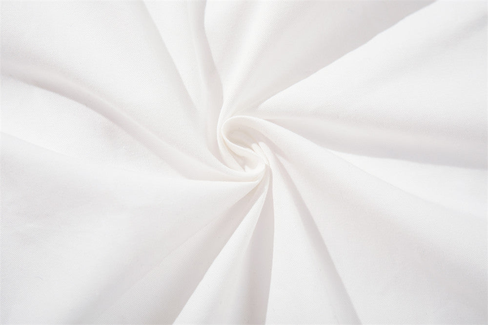 White fabric close-up with twisted fold texture