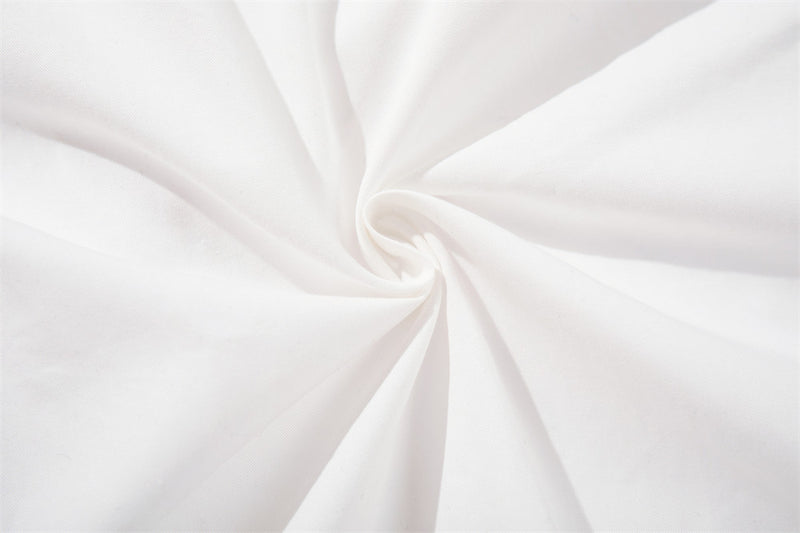 White fabric close-up with twisted fold texture
