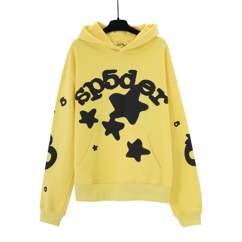 The Cheerful Yellow Sp5der Hoodie by Sp5der, with &quot;sp5der&quot; text in black and star designs, features the number 6 on the sleeves, a handy front pocket, and a hood. It&