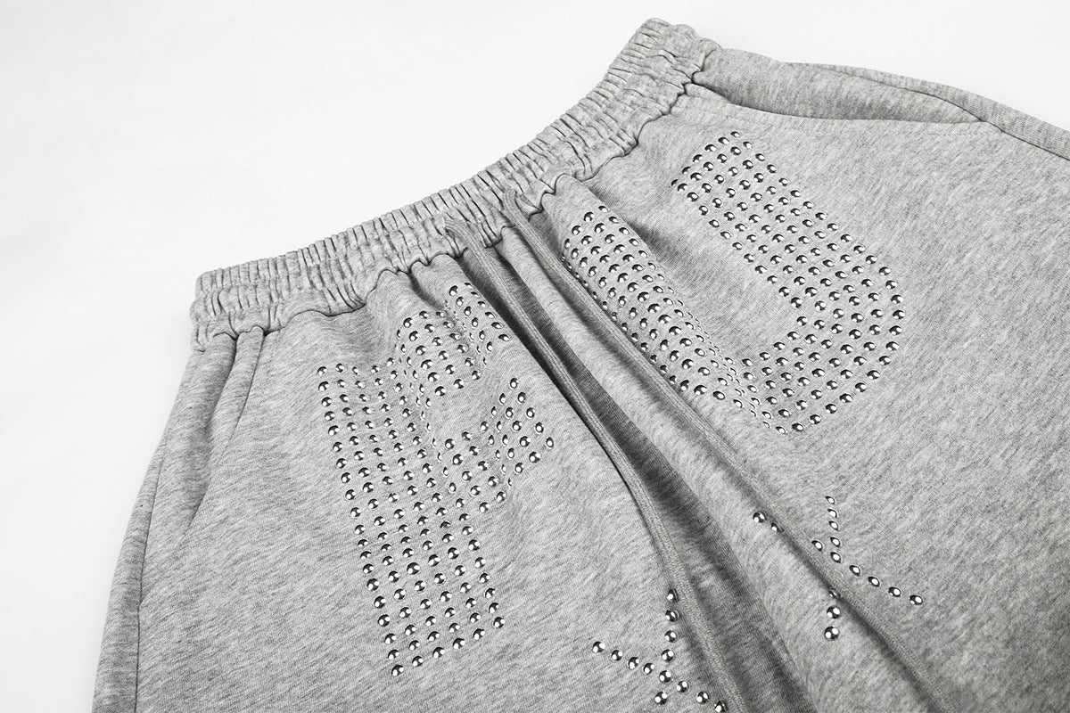Pantalon de survêtement à jambes larges avec motif FU en strass et délavage vintage