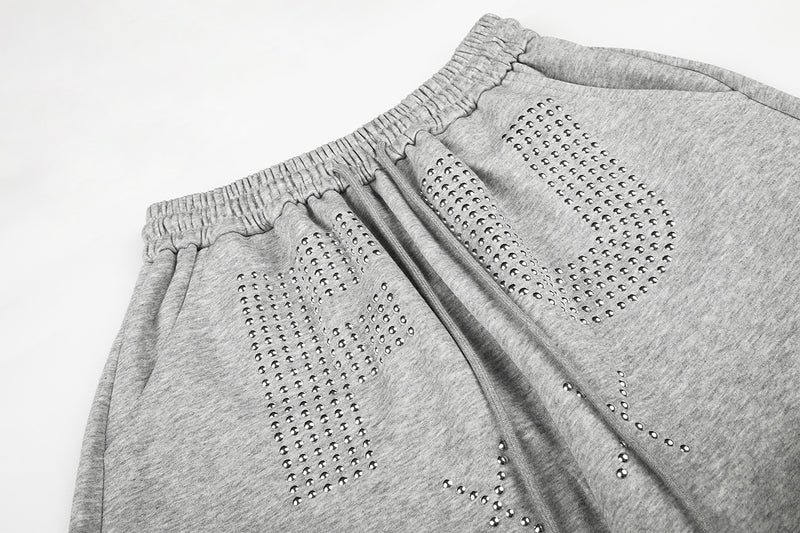Pantalon de survêtement à jambes larges avec motif FU en strass et délavage vintage
