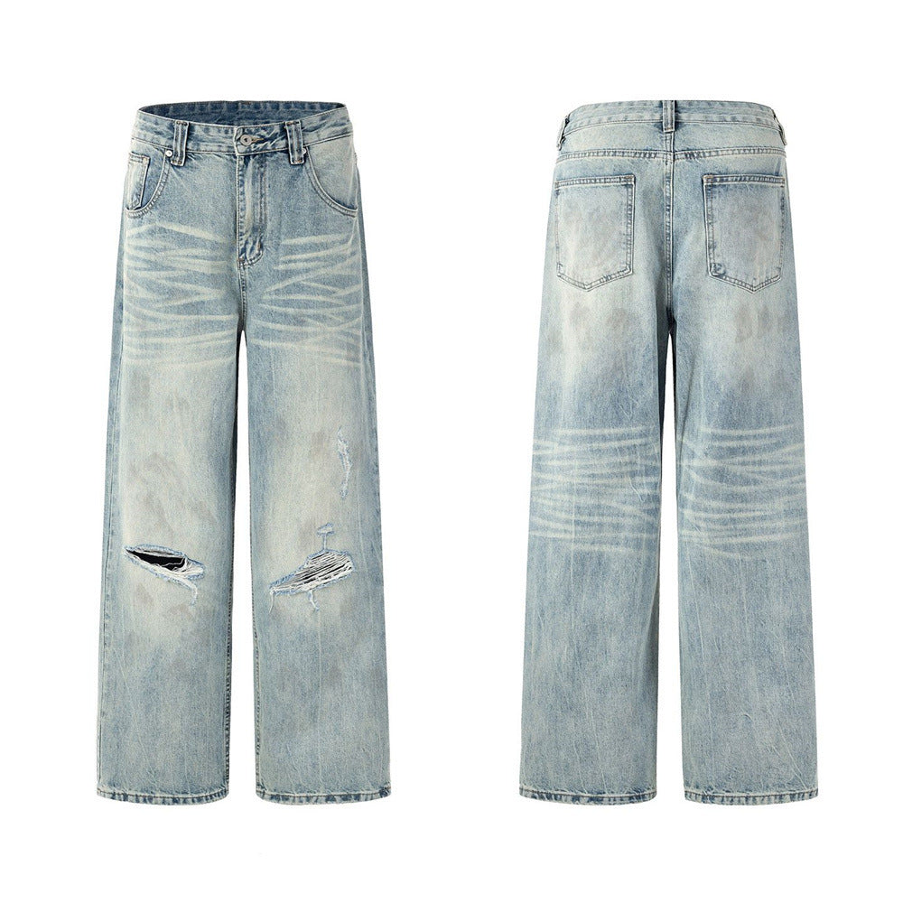 Men's wide-leg light wash distressed jeans with zebra bleach pattern and knee rips, front and back view