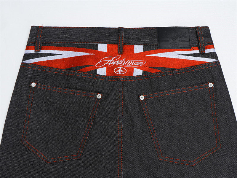 Herren-Flare-Jeans in Schwarz mit roter Script-Stickerei – Wide Leg aus Raw Denim