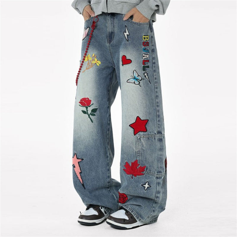 Vaqueros baggy de pierna ancha con flores bordadas, mariposas y motivos de patchwork