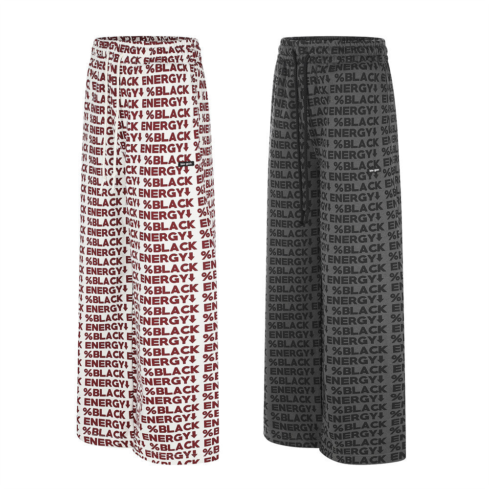 Baggy track pants in white and black with allover BLACK ENERGY letter print, front and back view
