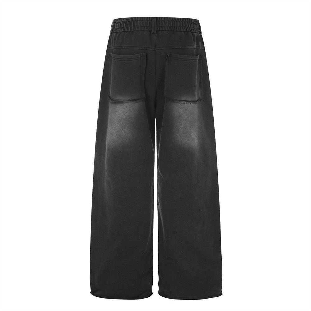 Pantalon de survêtement ample à œillets métalliques, finition délavée à l’acide & ourlet brut