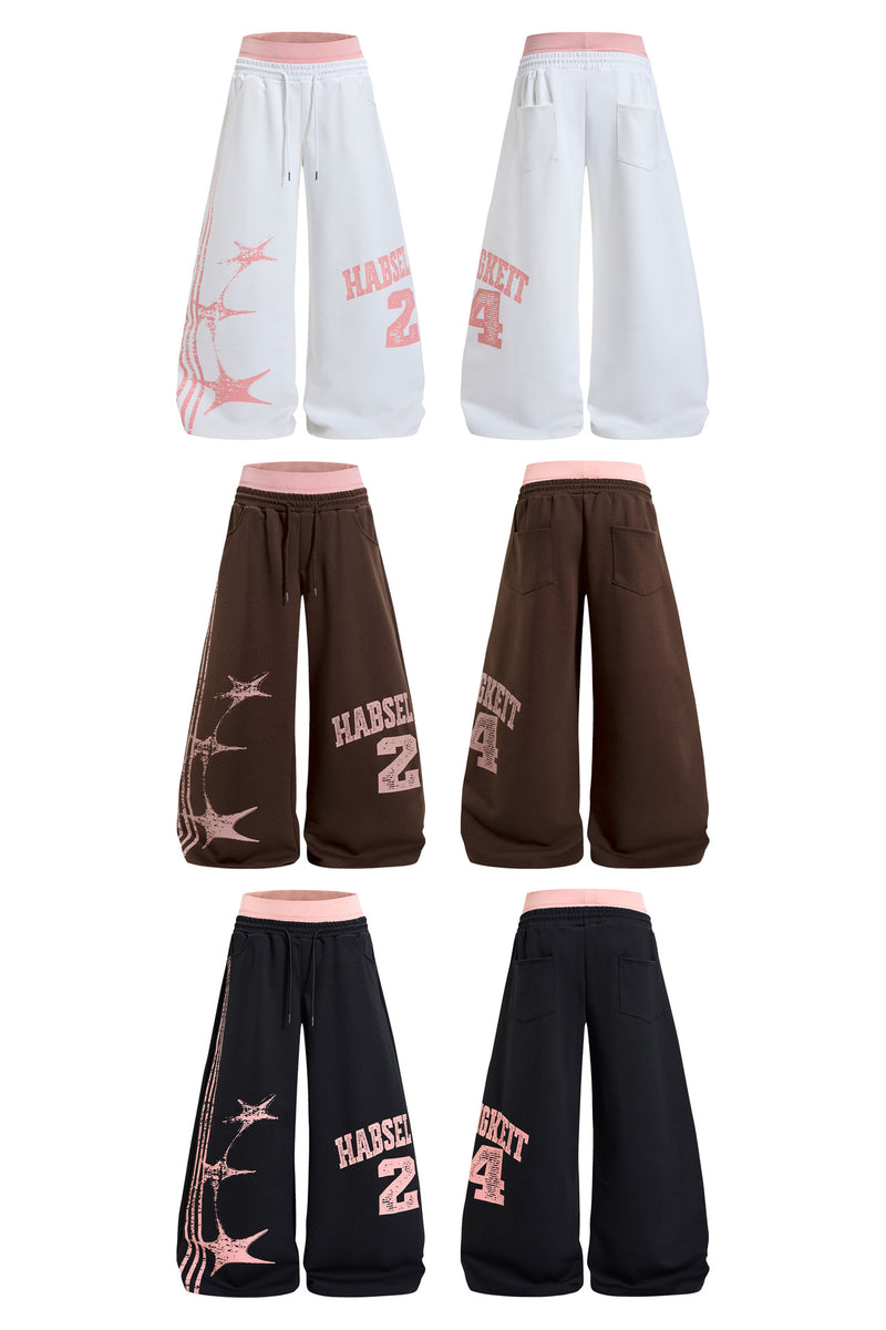 Pantalones de chándal de pierna ancha con estampado gráfico varsity y cintura rosa en contraste