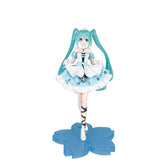 The Hatsune Miku Cinderella Fairy Tale 20cm PVC Figure features turquoise twin tails, a blue and white maid-inspired dress with Roman numerals around the hem, and stands elegantly on a blue, flower-shaped base for a magical, fairy tale charm.