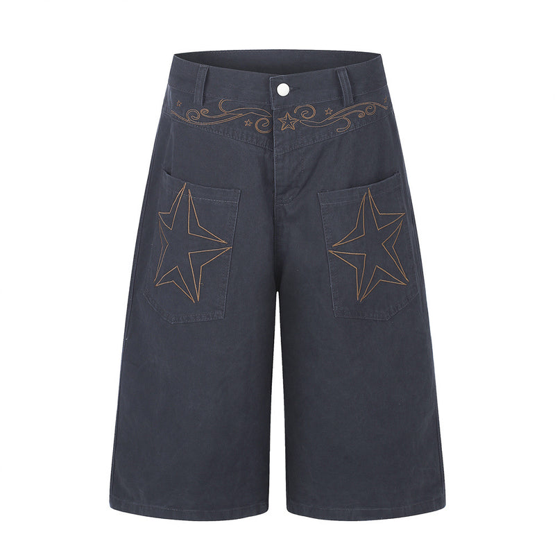Men's wide-leg cargo shorts with large star embroidery on front patch pockets and scrollwork waistband detail in washed navy