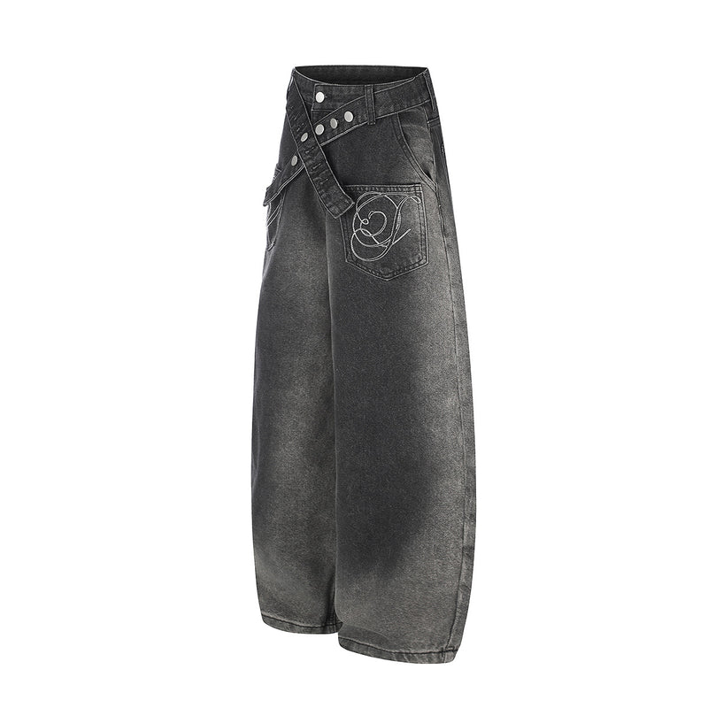 Vaqueros baggy de pierna ancha con cinturilla cruzada de broches y bolsillos bordados