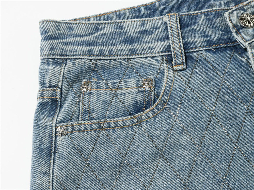 Close-up of light blue jeans front pocket and diamond stitch detail
