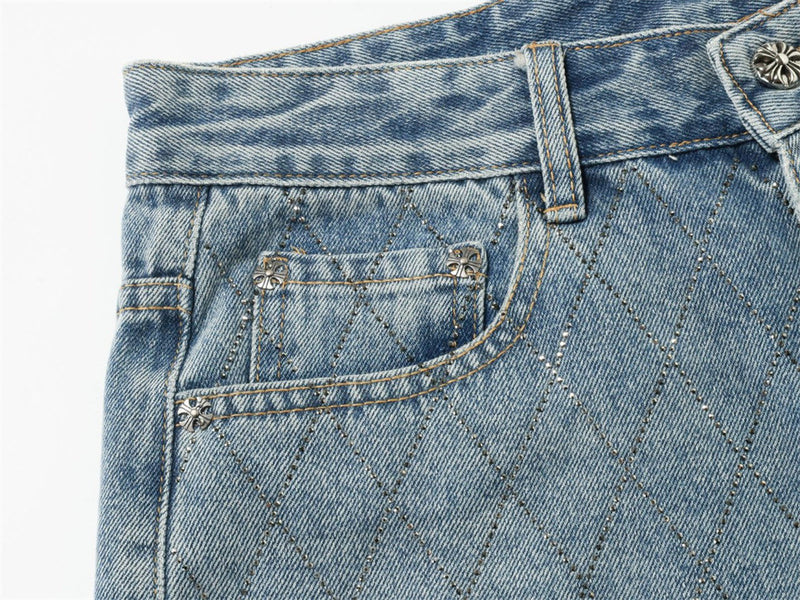 Close-up of light blue jeans front pocket and diamond stitch detail