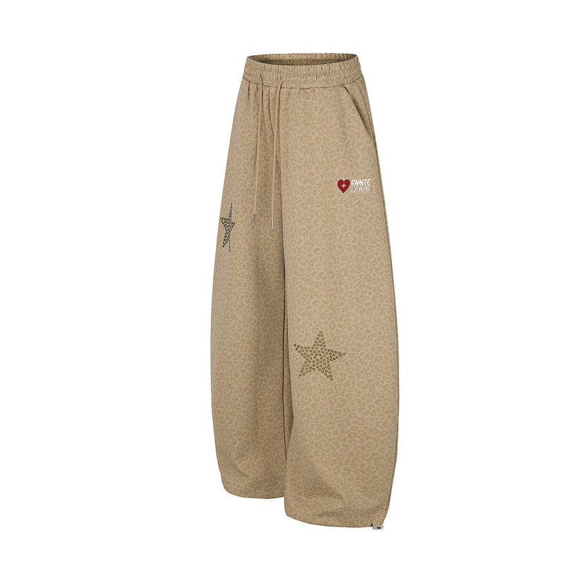 Pantalon de survêtement léopard à jambes larges avec étoiles dorées cloutées