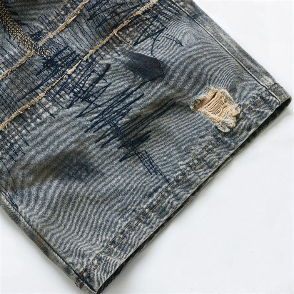 Baggy Wide-Leg Jeans – Chaotic Embroidery, Distressed Denim & Arc-Hem Design