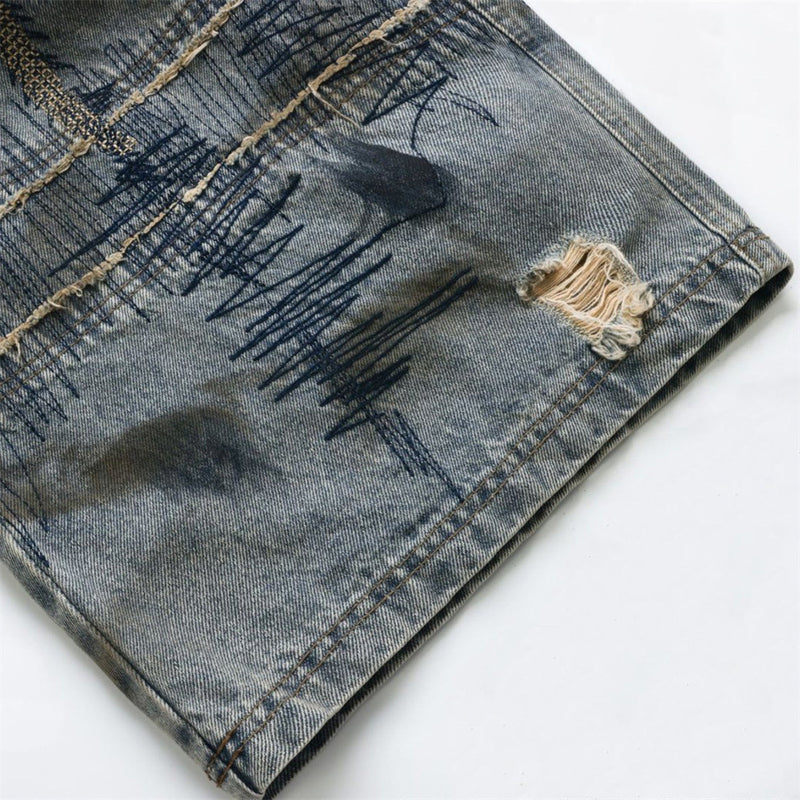 Baggy Wide-Leg Jeans – Chaotic Embroidery, Distressed Denim & Arc-Hem Design