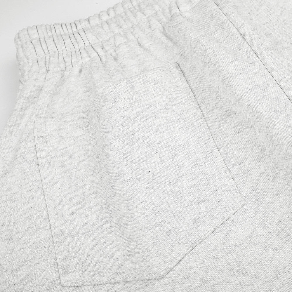 Jogging homme coupe large avec détails de boutons croisés et taille élastique
