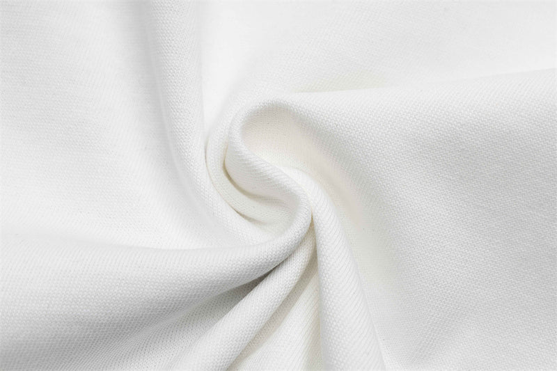 Close-up of white knit fabric texture with soft folds