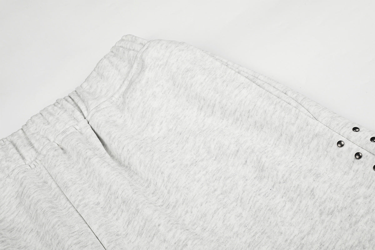 Jogging à jambes larges avec clous – Coupe ample et croix ornée de strass