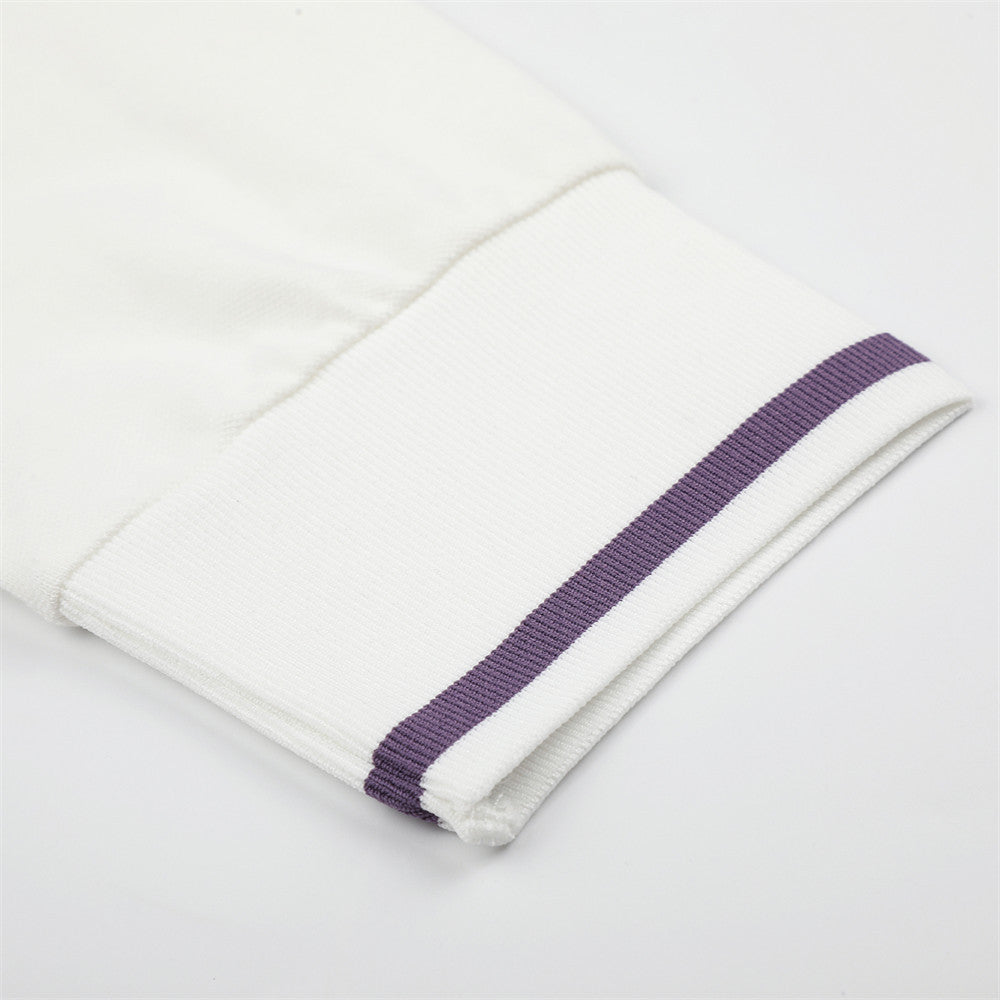 Close-up of white sleeve cuff with purple stripe trim