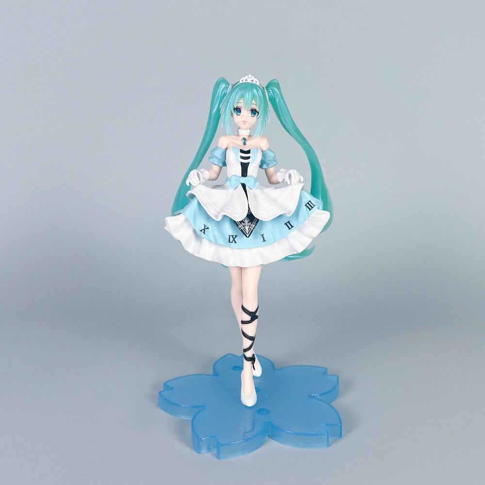 The Hatsune Miku Cinderella Fairy Tale 20cm PVC Figure features a character with long teal hair and a white and blue dress adorned with Roman numerals, a small crown, and black ribbon shoes. She stands on a blue flower-shaped base against a gray background, capturing her fairy tale allure.