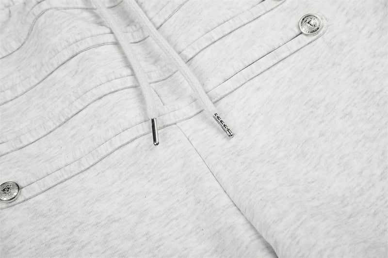 Jogging homme coupe large avec détails de boutons croisés et taille élastique