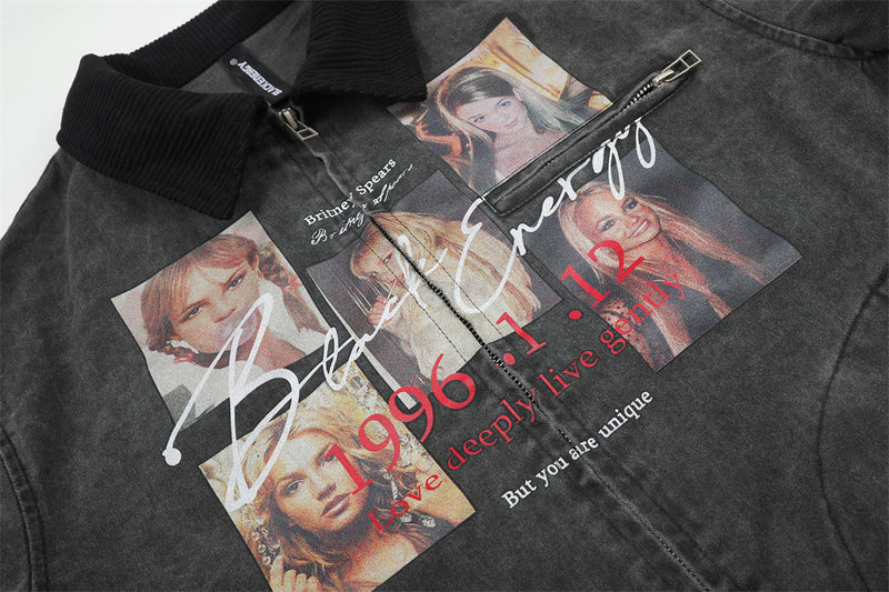 Close-up of black jacket front with Britney Spears graphic print and chest zipper pocket