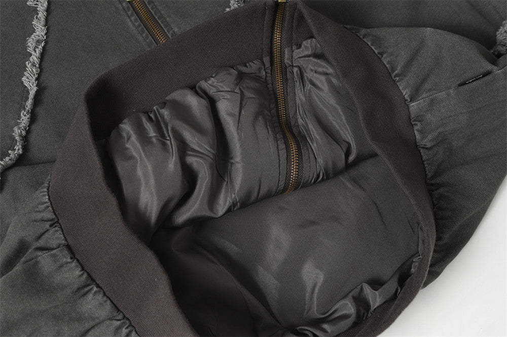 Blouson bomber déconstruit en toile à coutures effilochées et zip diagonal