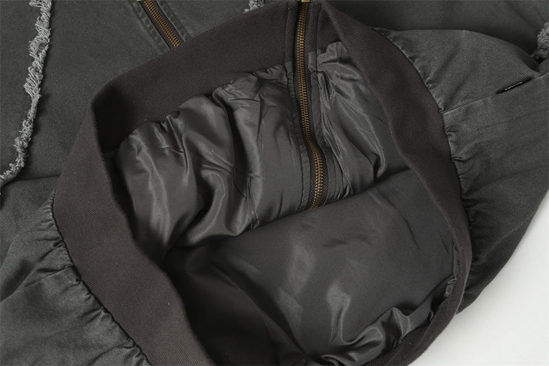 Blouson bomber déconstruit en toile à coutures effilochées et zip diagonal