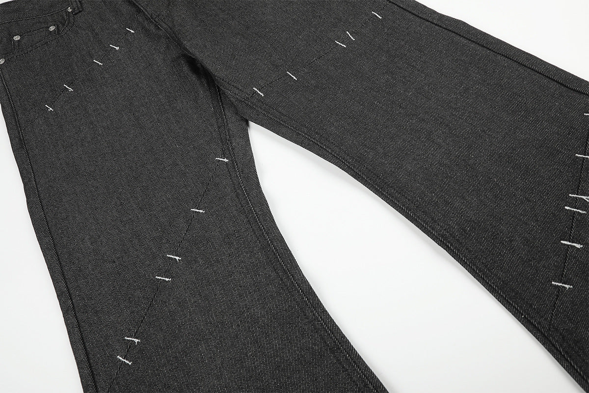 Wide-Leg Raw Denim Jeans with Deconstructed Stitch Detail — Black