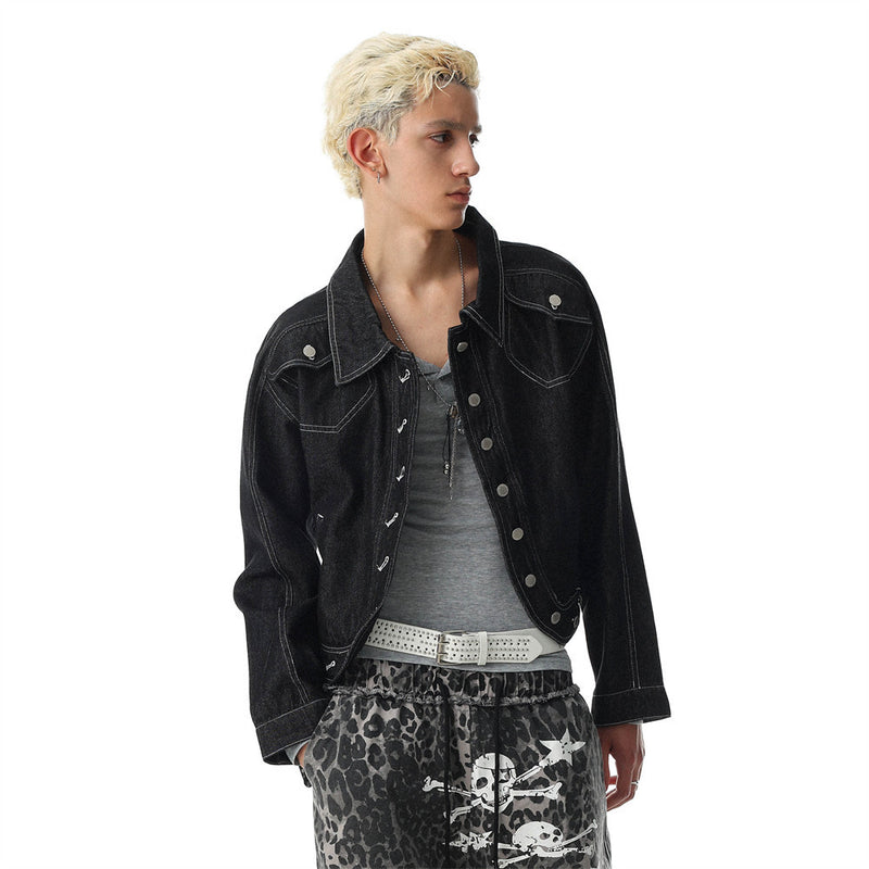 Model in black cropped jean jacket with wide collar and front snap closure