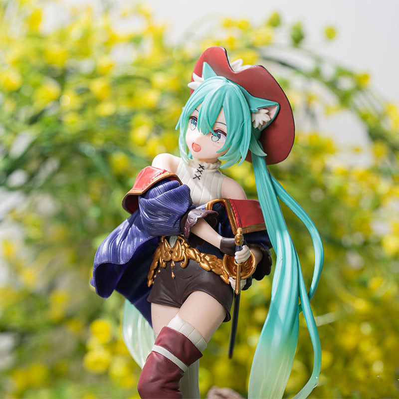 The Hatsune Miku Puss in Boots Fairy Tale 18cm PVC Figure by Hatsune Miku features the iconic character with long teal hair, a red cat-eared hat, a purple cape, white top, brown shorts, and a sword against a backdrop of yellow flowers and greenery.