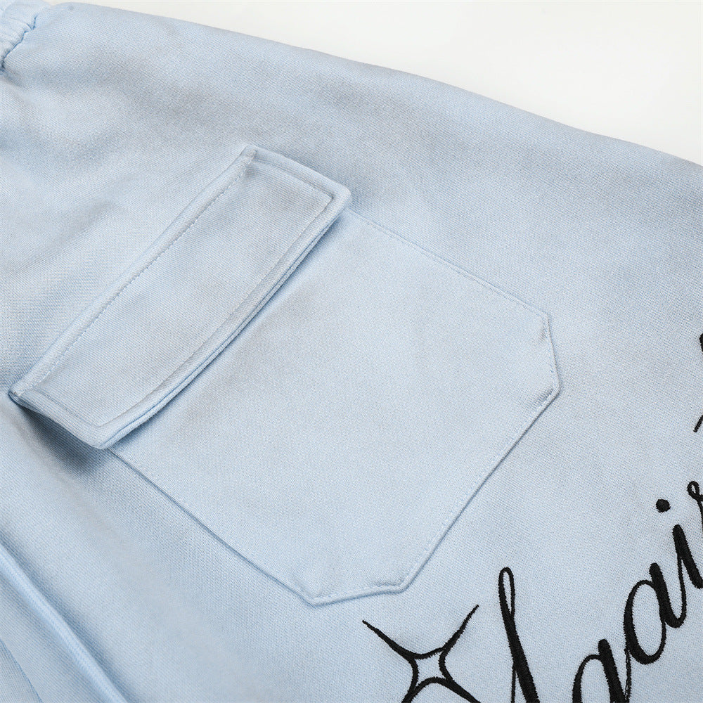 Pantalon de survêtement en velours côtelé à jambes larges avec imprimé script et poches cargo